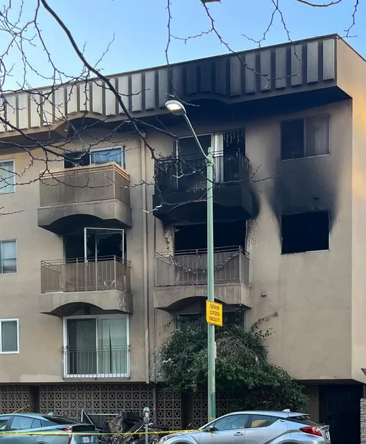 Fire-damaged apartment building exterior
