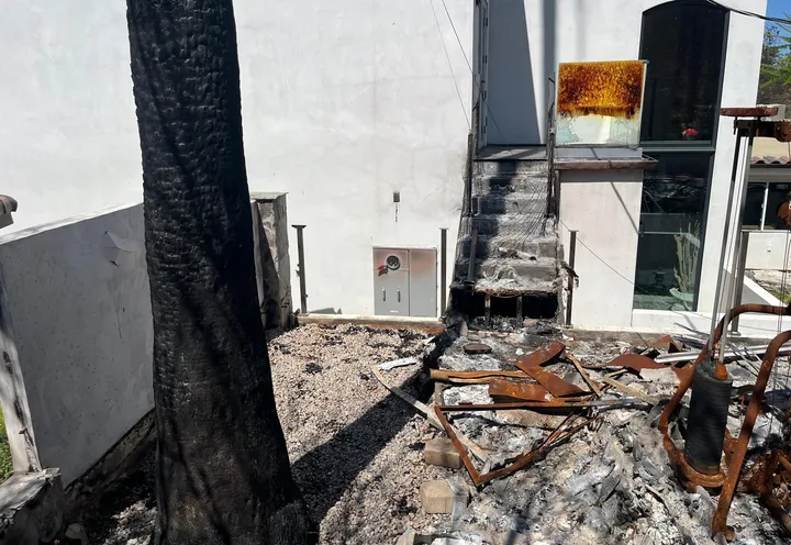 Modern home exterior after a fire.