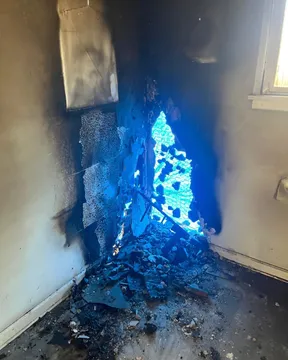 Smoke staining along the corner of a room, field photograph.