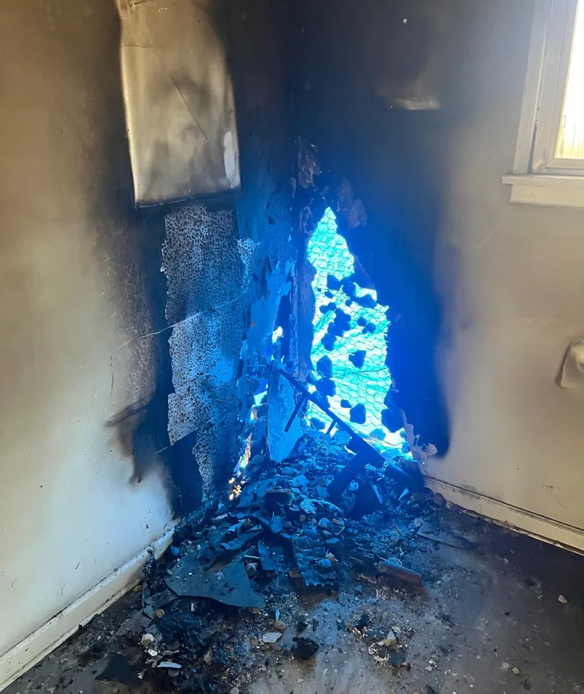 Smoke and fire damage in the corner of a burned room