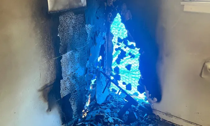 Smoke and fire damage in the corner of a burned room