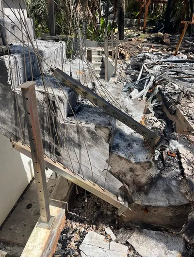Close detail of a fire-damaged exterior stair after a loss.