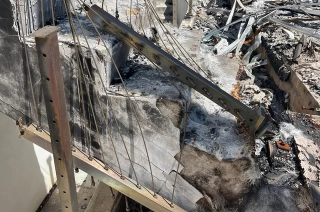 Close view of broken framing after a tree strike.