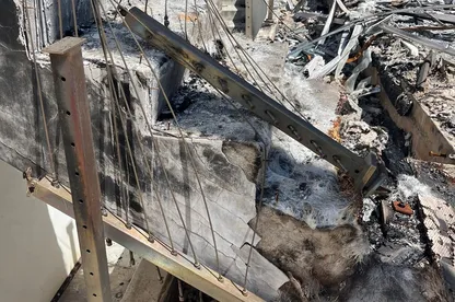Close view of broken framing after a tree strike.