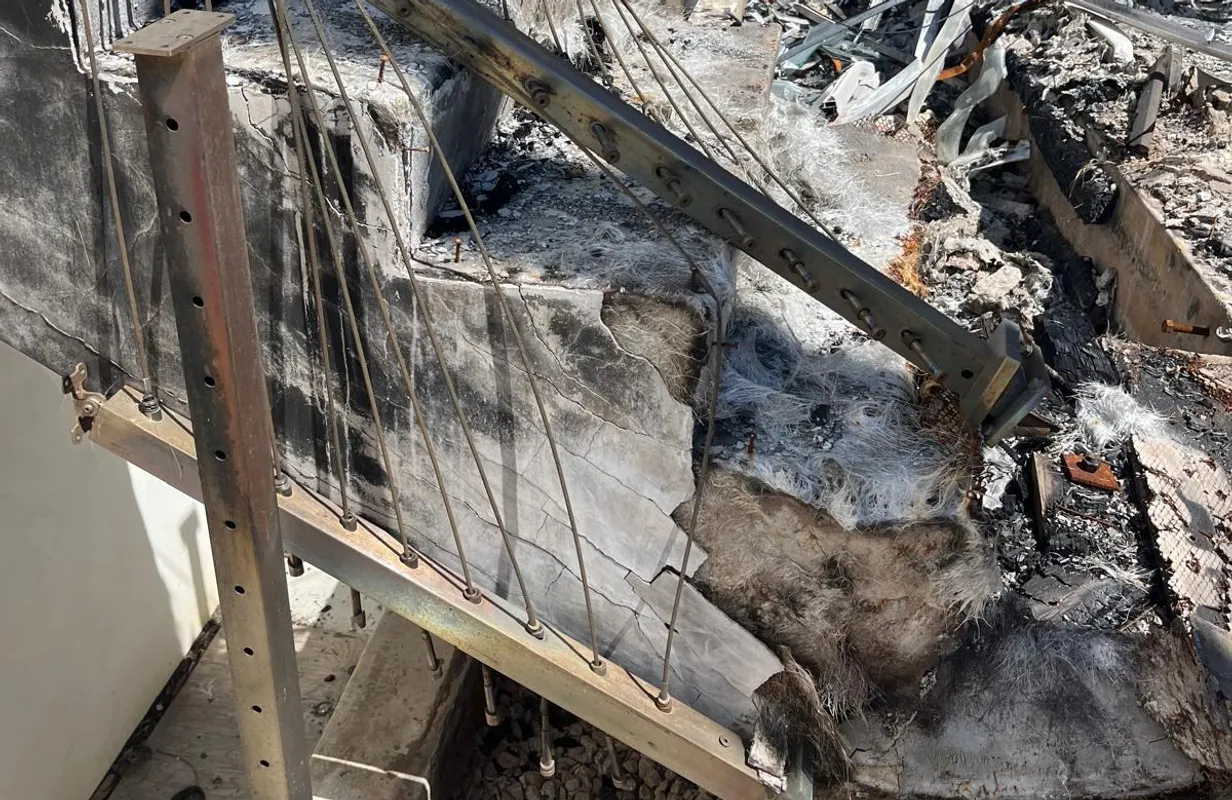 Exposed structural framing at a stair, opened up for inspection